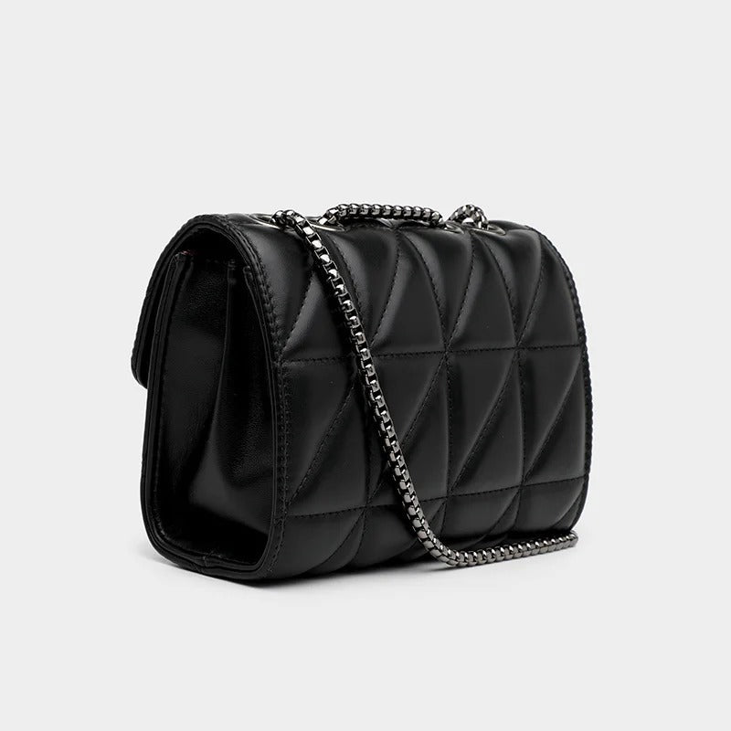 Black quilted leather handbag with a silver chain strap.