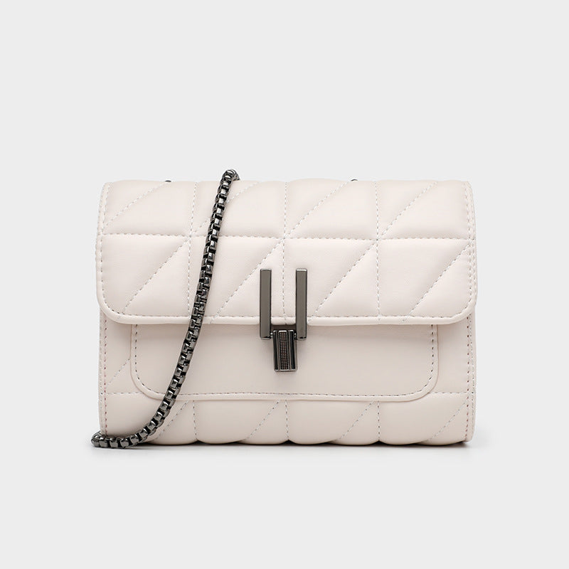 Off-white quilted leather handbag with a dark chain strap and metal clasp.