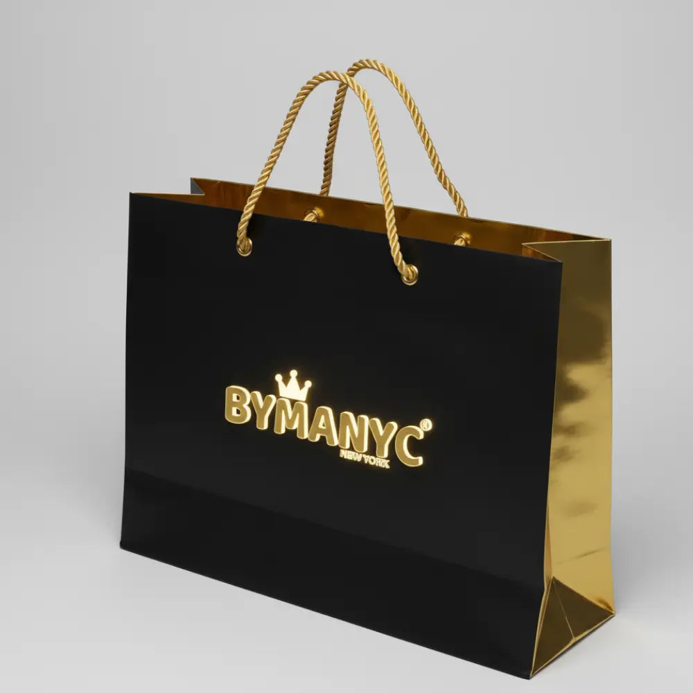 Black and gold shopping bag with "BYMANYC" logo and rope handles.
